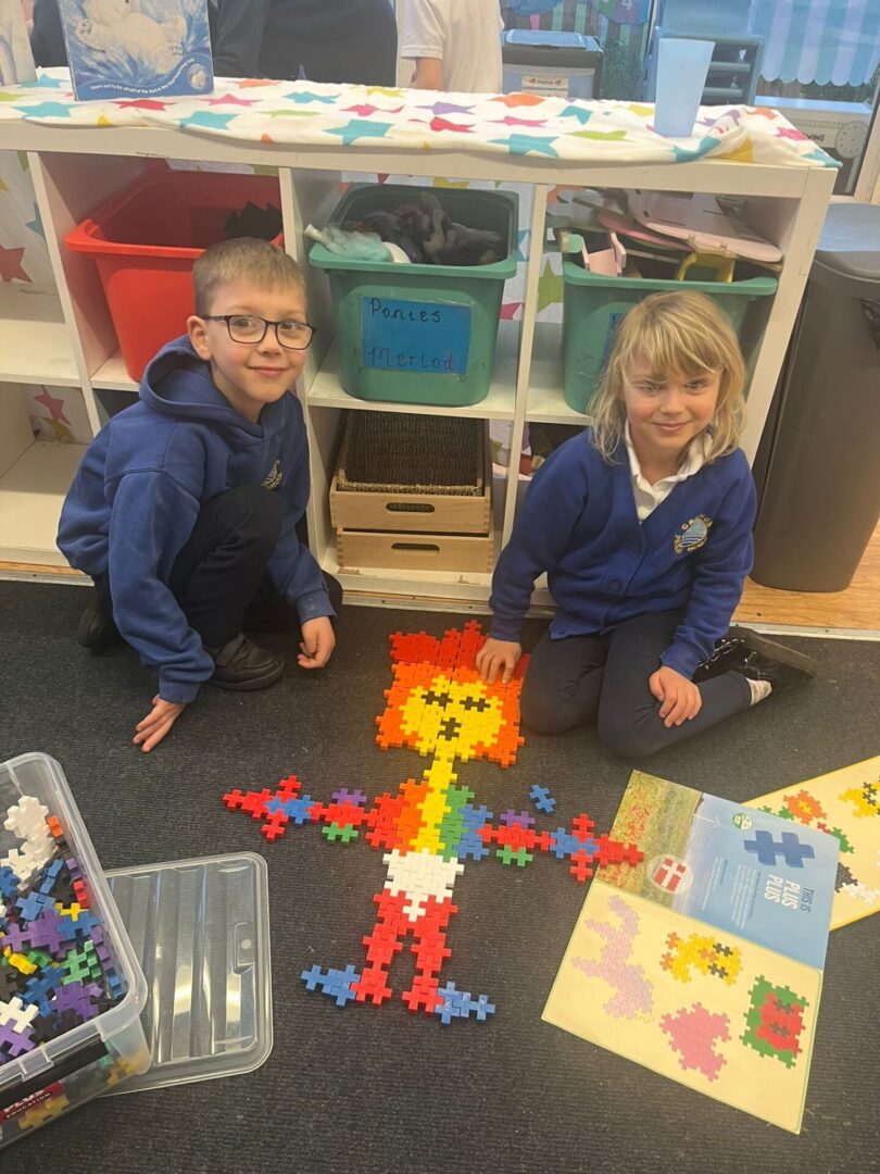 two children working together on solving a puzzle